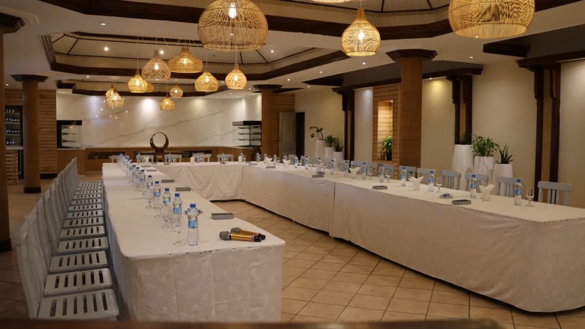 Conference table with microphone and place settings